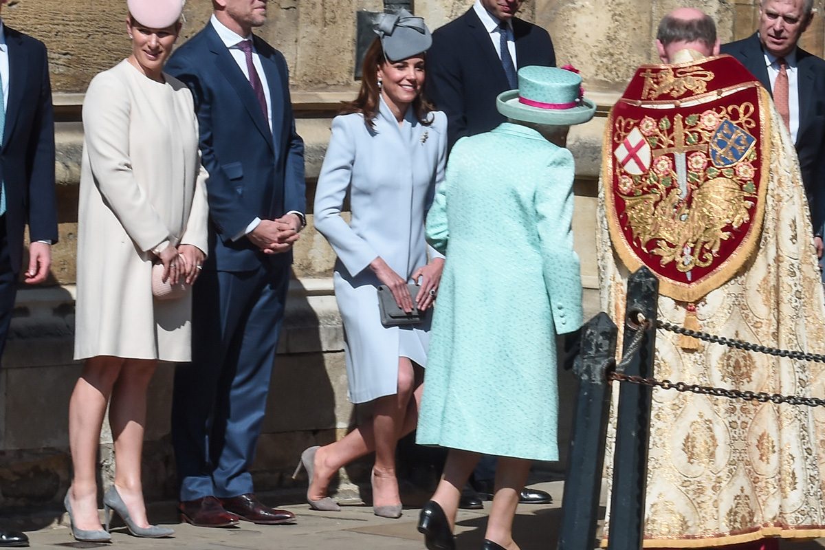 Kate Middleton demonstrates one of the hallmarks of royal etiquette, the curtsy, as she greets Queen Elizabeth outside St. George's Chapel in Windsor