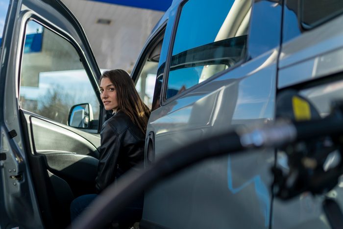 Beautiful woman at the gas station.