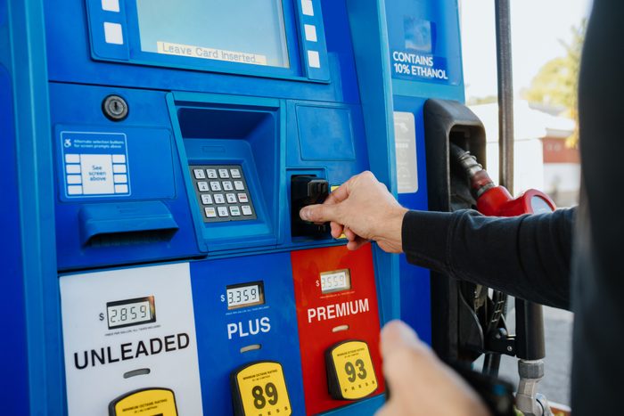 Man Purchases Gas at Pump