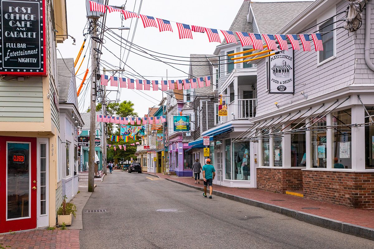 Street scene in Provincetown, MA on Cape Cod in historic tourist district with people visible