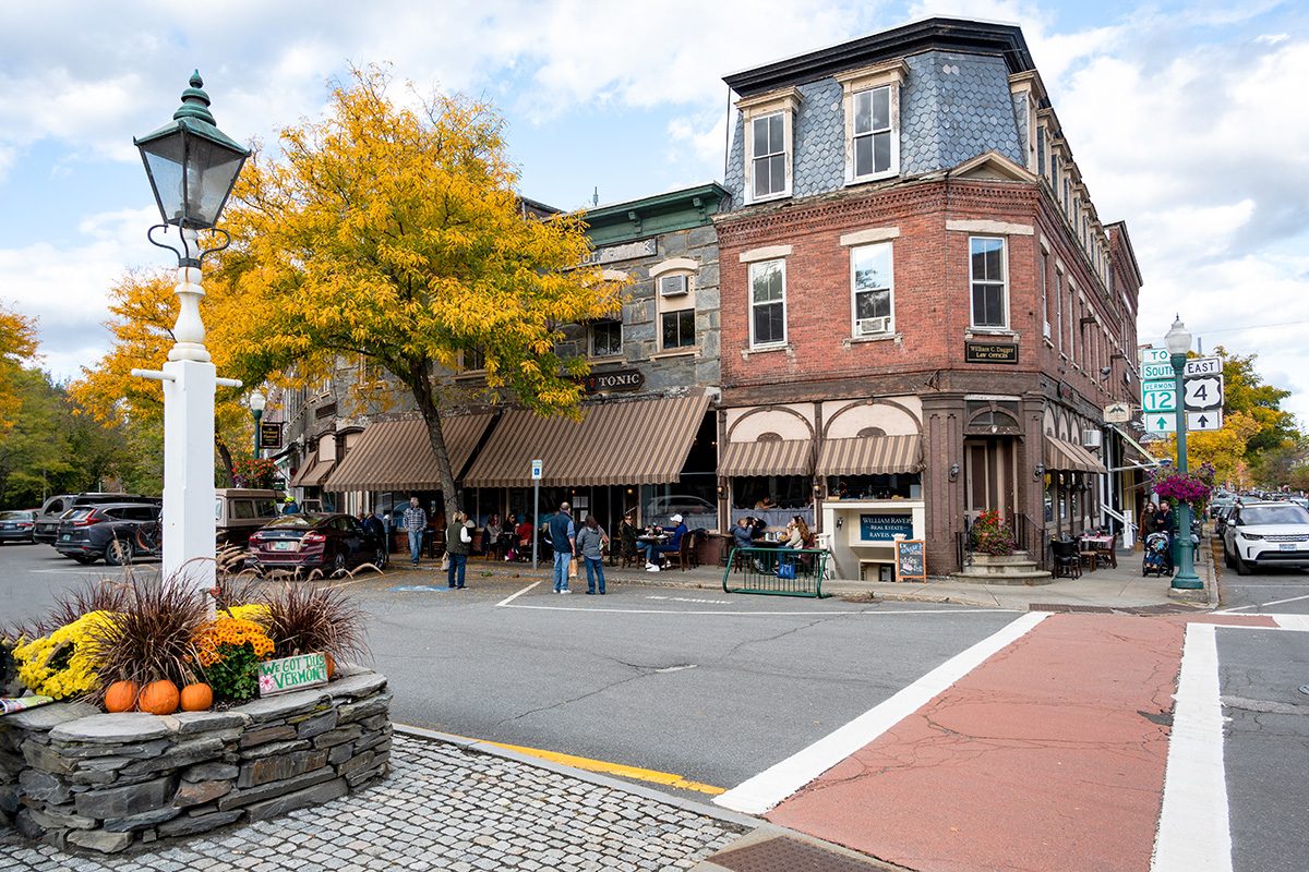 Tourists and Shoppers on a street corner in the quaint New England town of Woodstock, Vermont